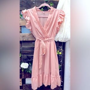 Maternity pale pink ruffle dress.
